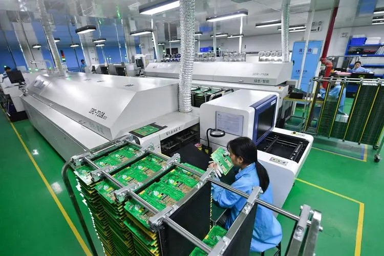 Inside Benchu Group's OEM/ODM PoE switch factory: production line handling SMT assembly, functional testing, and custom branding for client orders.